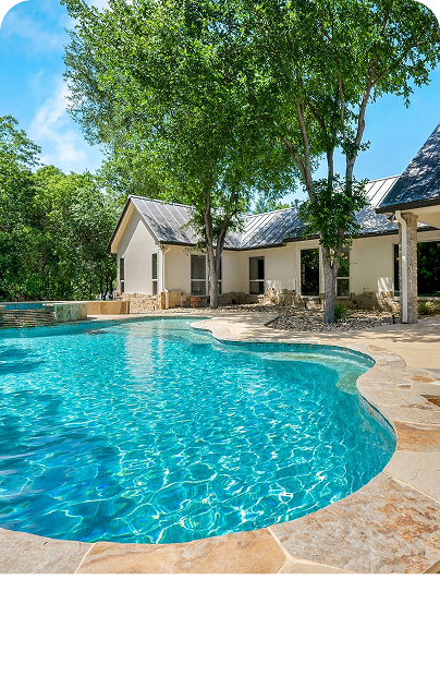 A serene backyard with a pool and patio.